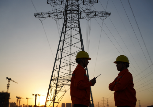 Team of young utility workers discussing work